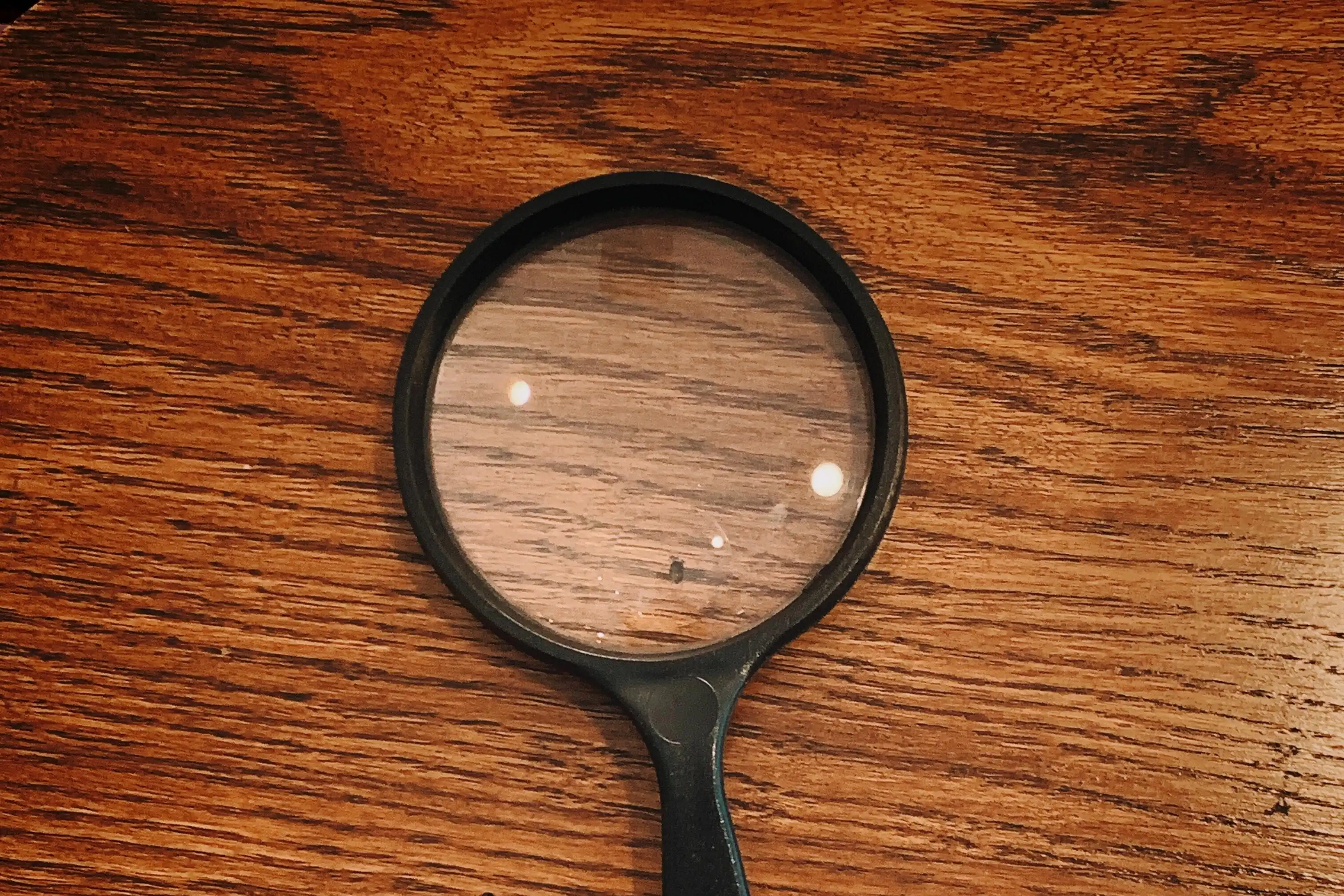 A magnifying glass, representing quality